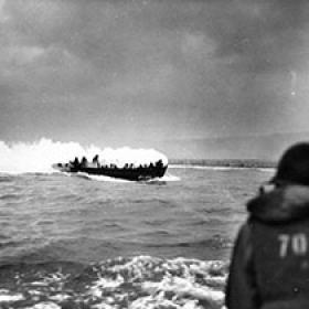 An LCVP Makes Its Way to Omaha Beach on Fire
