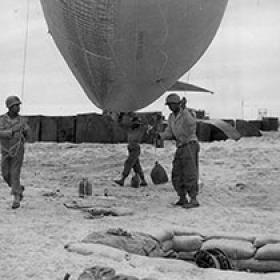 Soldiers of the 320th Very Low Altitude Barrage Balloon Battalion Prepare to Deploy a Balloon on Omaha Beach