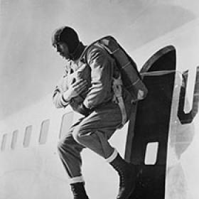Airborne Soldier Illustrating a Jump from a Plane during Training