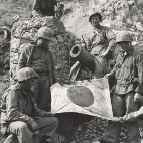 Marines Hold Captured Flag on Iwo Jima
