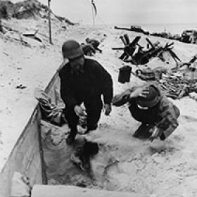 Naval Demolition Troops Run for Cover on Omaha Beach