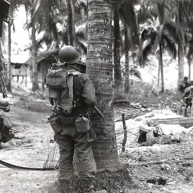 Soldiers Make Their Way Through Village, Luzon