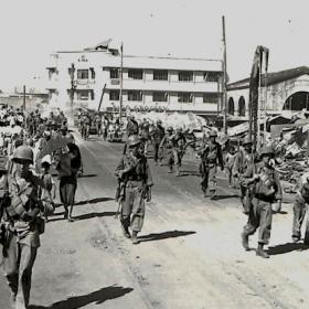 Troops Walking Through Destroyed Manila