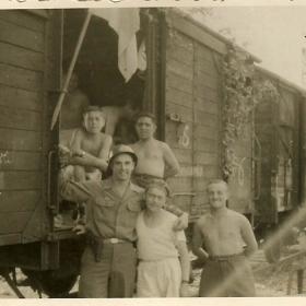 Lothar Kahn stands with Buchenwald concentration camp survivors, on their way to displaced persons camp. 