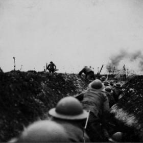 An officer leads the way over the top, April 7, 1918.